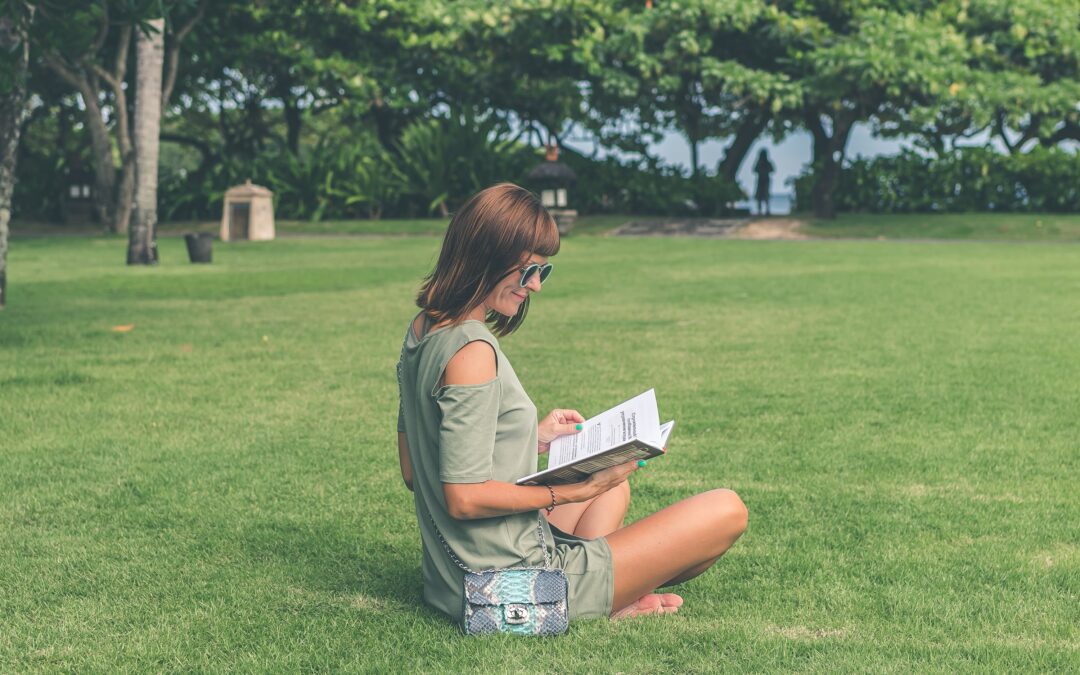 Woman sitting in the park researching debt inheritance